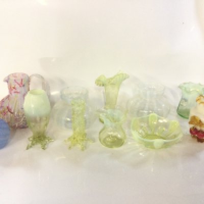 A collection of eleven pieces of Victorian Vaseline and uranium glassware vases and a dish.