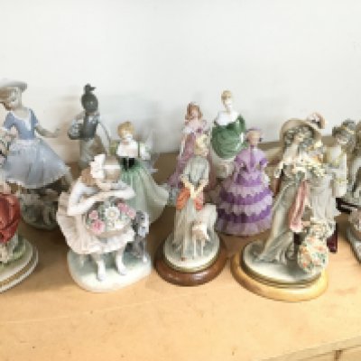 A collection of Doulton, Lladro and Capodimonte figures some with minor damage . This lot cannot be posted