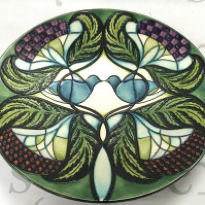 Moorcroft pottery circular charger decorated in the Blackwell by Nicola Slaney, dated 2008, , 28cm wide. This lot cannot be posted