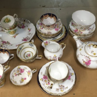 A Collection of various saucers and cups including Royal Albert Tea Rose, New Chelsea Staffs etc. this lot cannot be posted
