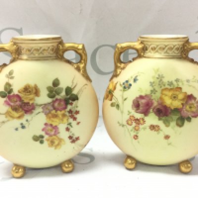 Royal Worcester Blush Ivory moon flash style porcelain vases with floral decoration, gilt handles and feet . 11cm wide 13cm tall. This lot cannot be posted