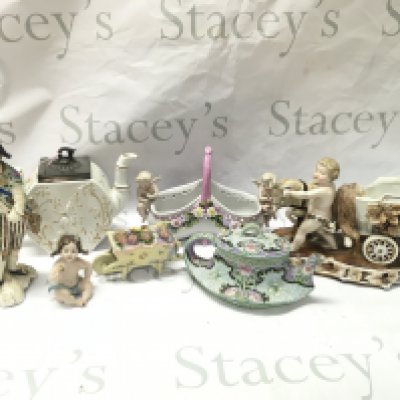 A Collection of early 20th century ceramics including an Crane design teapot, Capodimonte small girl figure , Italian Depose cherub basket , German Putti with chariot and goat figure group. This lot cannot be posted