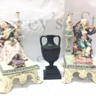 A pair of classical style seated couple figures (20cm tall approx. Damaged and restored )and a late 19th century bronze twin handled vase with putti scene decoration, 13cm tall. This lot cannot be posted