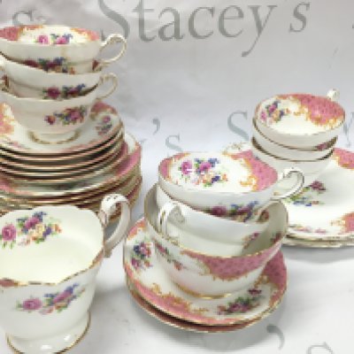 A pink Paragon tea set including saucers, cups . This lot cannot be posted