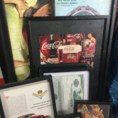 A large collection of various vintage pictures including a framed Cadillac advertisement , Whitmans sampler chocolate and confections advert, Coca Cola advert, Royal crown cola, framed Coca Cola puzzle.this lot cannot be posted