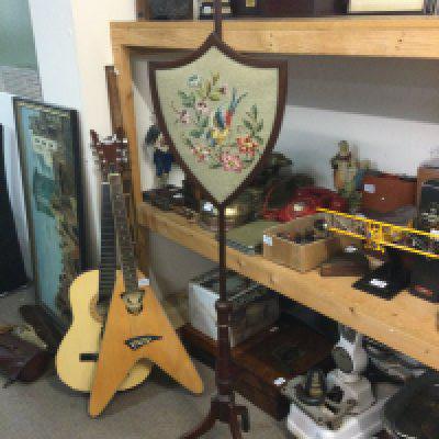 A Victorian pole screen 163cm tall.