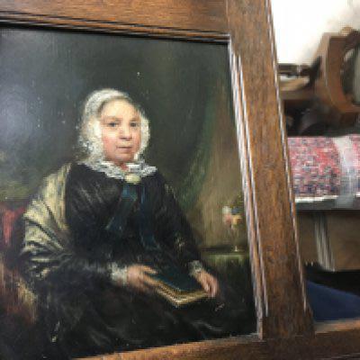 A oak framed mirror inset with two oil paintings on board 115 cm x52 cm