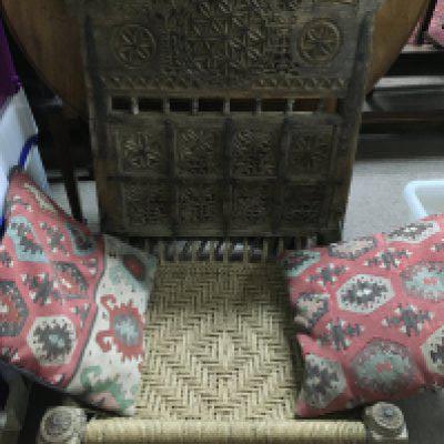 An antique Indian carved chair. Shipping category D.