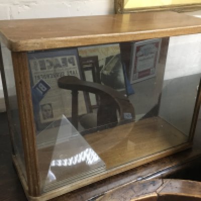 A glass display cabinet , 55cm wide 40cm tall 20cm wide