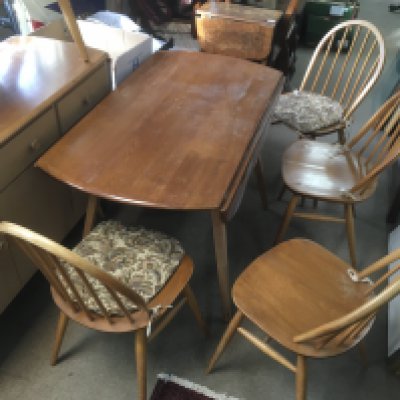 An Ercol dining table and four chairs 82cm tall 62cm wide 69cm tall