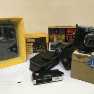 A collection of Vintage cameras boxed and as new Kodak Instamatic 133 Kodak EK160 instant flash Model C a Cosmic 35 with box and other cameras.- NO RESERVE