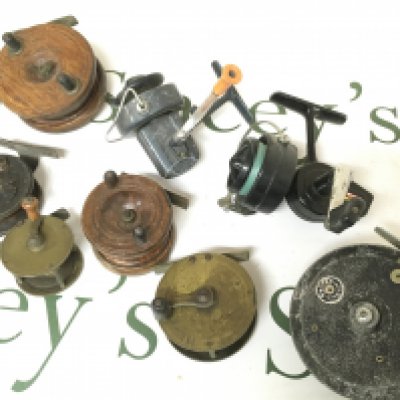 A collection of antique and vintage fly fishing reels including Seldex J.W YOUNG, brass and wooden reels , spinning reels including Garcia Mitchell 320 etc. postage cat B. NO RESERVE