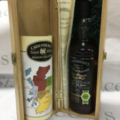 A bottle of 26 year old single malt cadenheads scotch whiskey with with paper work in a wooden presentation box. Very good condition and level.