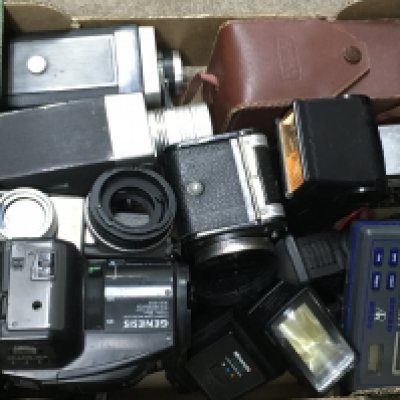 A box of vintage camera accessories . No reserve Postage category c