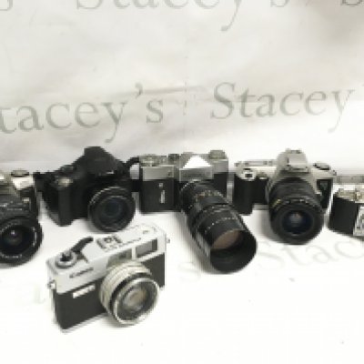 Six vintage cameras including Canon, Minolta, etc. postage cat C