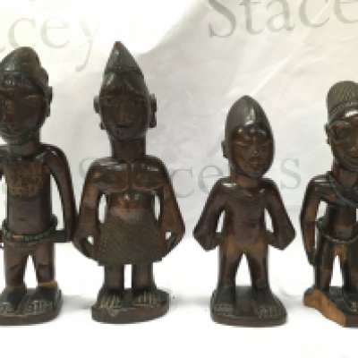 Four caved African wooden figures, believed to be from the Bamabra tribe. 26cm tall. Postage category B