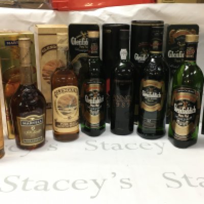 A Collection of boxed whiskey including Glenfiddich single malt , Cockburns 1989 port, Courvoisier fine champagne . This lot cannot be posted
