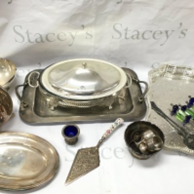 A Collection of silver plated items including Dishes, Cups, Cutlery , Galleon jug, unusual coloured glass handled cheese knives , a silver hallmarked handled pie server,two silver copies of a traditional religious icons George slaying the dragon and virgin Mary. This lot cannot be posted