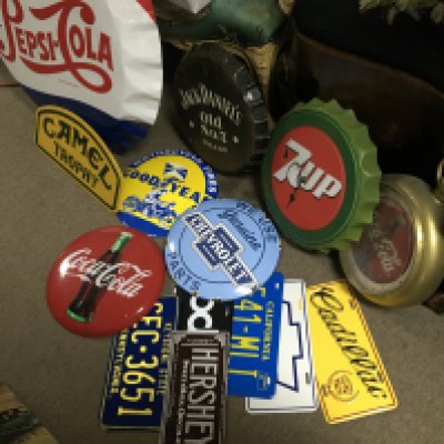 A Collection of vintage metal advertising signs including a large Pepsi bottle cap sign, camel, good year, Jack Daniels etc. this lot cannot be posted