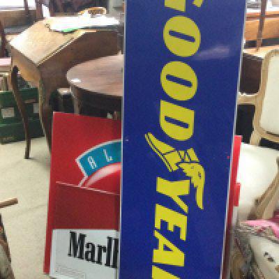 A collection of vintage advertising signs including Goodyear, Marlboro, Indian Roadking, Always Coca Cola. This lot cannot be posted
