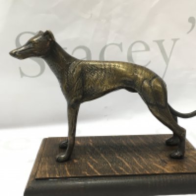 A bronze greyhound on a oak base 15cm tall. Postage category b
