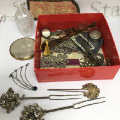 A collection of items comprising vintage Oriental style hat pins, belt buckles, a Stratton compact etc. Shipping category B.