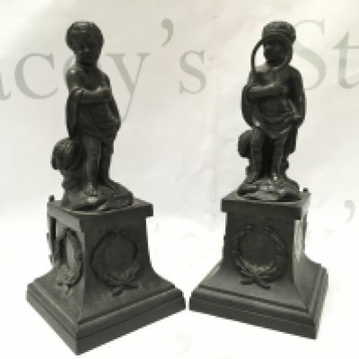 A pair of 19th century bronze cherub figures with detachable bases , the base decorated with garlands . 20cm tall. Postage catB