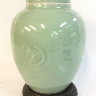 A green vase , 25cm tall . This lot cannot be posted