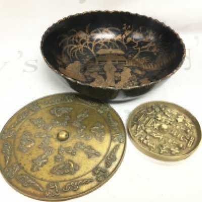 Two Chinese bronze mirrors 17 and 10cm wide and a Japanese bowl 23cm wide. Postage category B