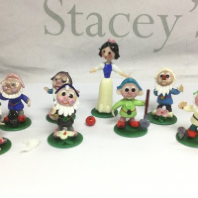 A set of glass Snow White and the Seven dwarves figures. Shipping category D.