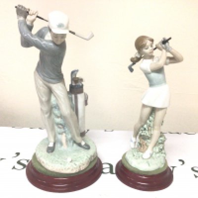 A Lladro figure of a Male Golfer in action and a conforming NAO female figure no obvious damage (2)