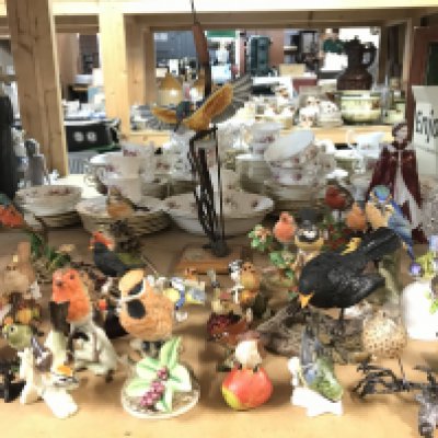 A large collection of bird figures including the Heritage collection, Goebel etc, this lot cannot be posted