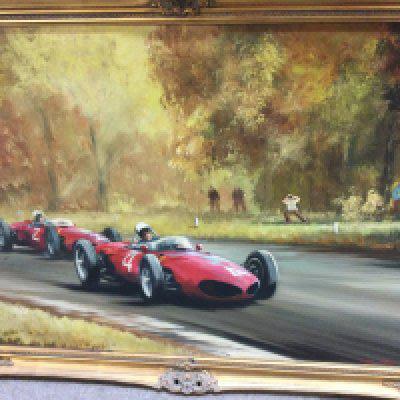 A framed Dion Pears oil painting depicting racing cars . 88 cm x 62 cm .