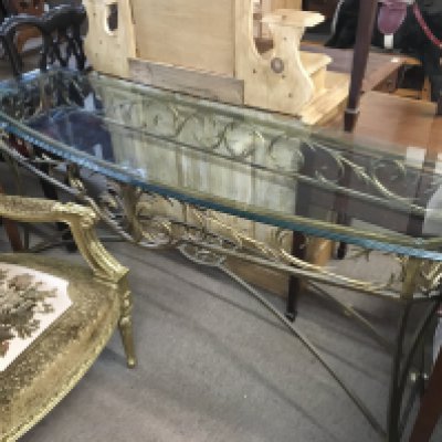A modern glass with gilt wrought iron frame, 168cm wide 82cm tall