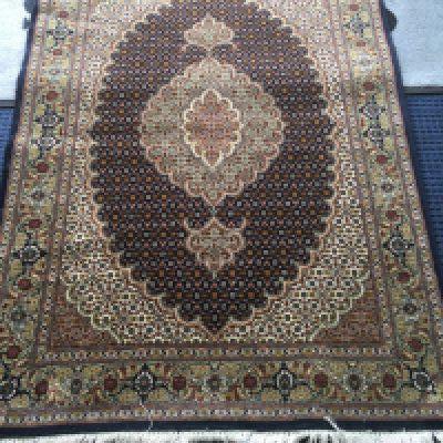 An Iranian part silk rug, approx 102cm x 145cm. Shipping category D.