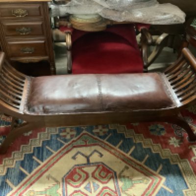 A Regency style leather upholstered window seat. 120cm x 52cm x 36cm.