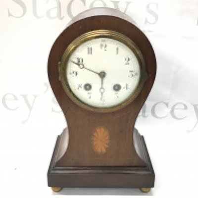 A mantle clock with inlaid design and French movement , this lot cannot be posted