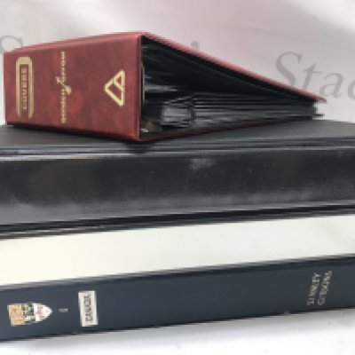 Four stamp albums containing British , Canadian and Commonwealth stamps. Mint and used. Postage category C