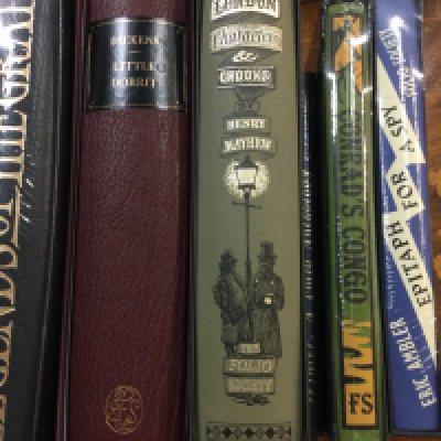 A box of books including Folio Society.