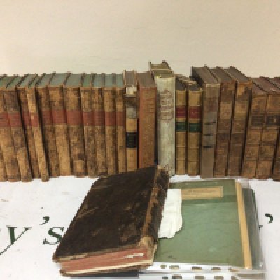 A collection of leather bound and half leather books early 19th century and later and a large illustrated antique bible.