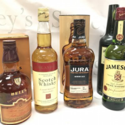 Whiskeys including Highland Earl Scotch Whisky, a boxed bottle of Jura single malt scotch Bourbon cask, Boxed Bells 12 year, Jameson Irish Whisky . This lot cannot be posted