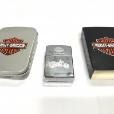 A Harley Davidson FXST softail zippo lighter with packaging in excellent condition. Postage A