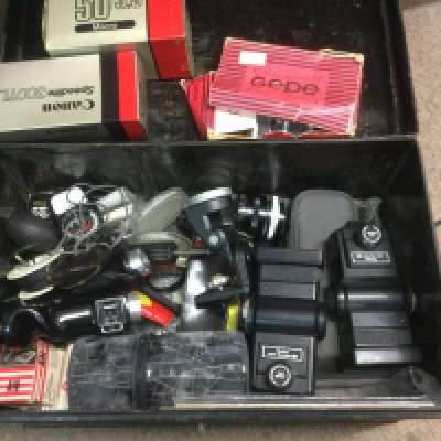 A tin containing a collection of vintage cameras. Shipping category D.