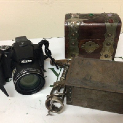 A collection of items comprising a Nikon Camera small metal bound casket Vintage corkscrew and a tin U9 sinking a battle Ship. (4)