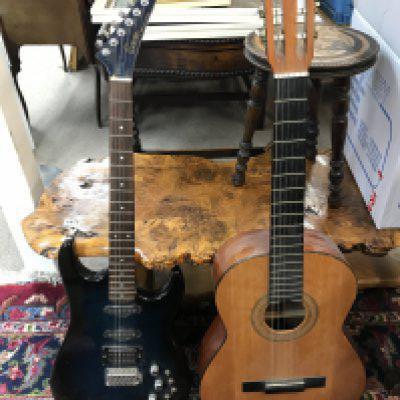 An Encore Hunter 644 series electric guitar and a Bespana classical acoustic guitar . This lot cannot be posted