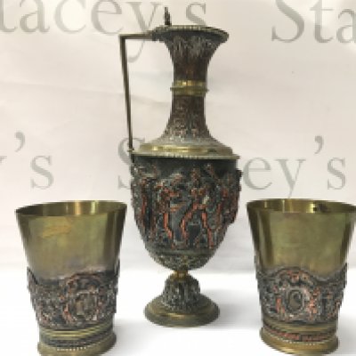A Renaissance Revival Classical Ewer by JG & Sons (30cm tall approx) and a pair of matching goblets decorated with figures. (11.5cm tall)
