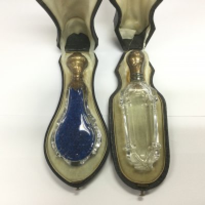 Two Victorian leather cased glass scent bottles. Shipping category D.