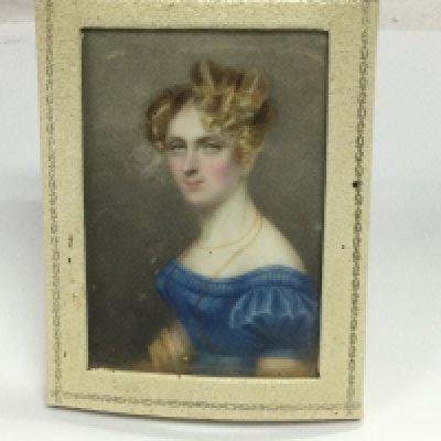A small early 19th Century portrait miniature of a lady. Shipping category A.