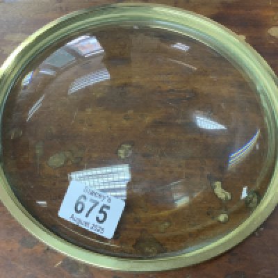 A large Convex magnifying lense with coin edge brass mount. 23cm Diameter.