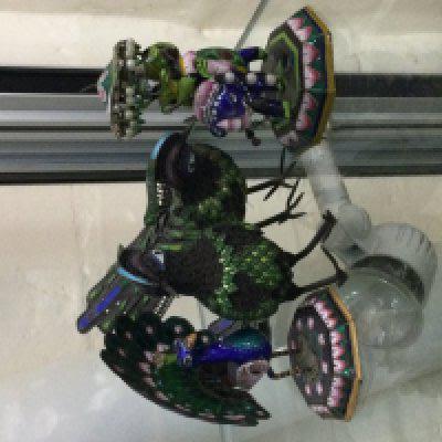 Four silver and enamel ornaments one in the form of a Elephant.